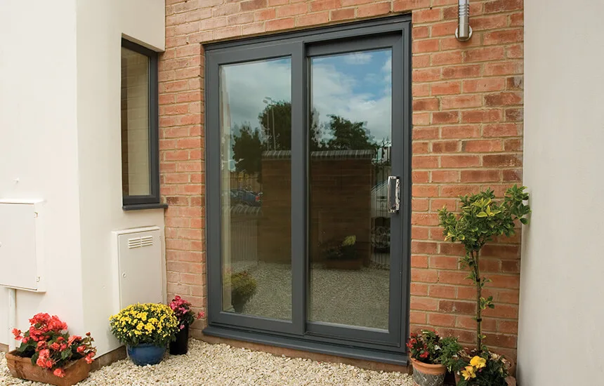 Grey uPVC sliding patio door installation
