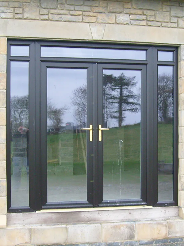 Black aluminium sliding patio door overlooking garden