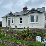 wide view of newly installed white upvc sliding sash windows