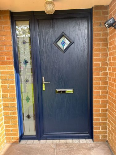 close-up view of blue composite front door installation