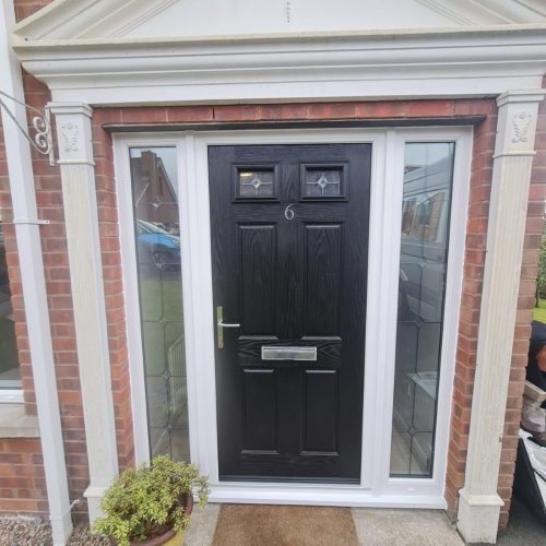 close-up of black front door installation