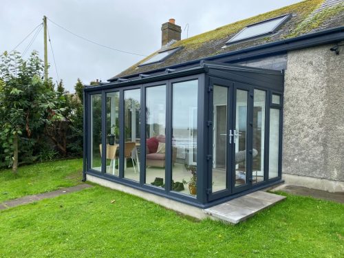 external view of a newly installed conservatory by turkington, featuring new french doors