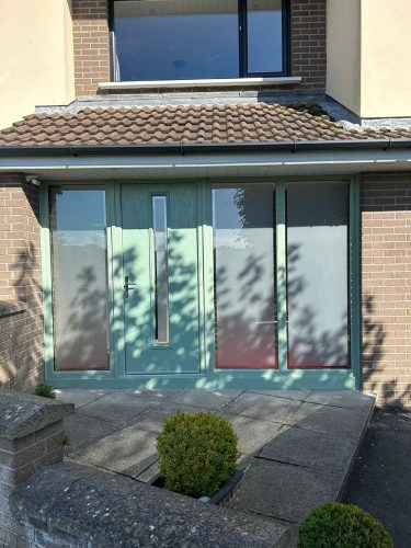 newly-installed chartwell green porch with chartwell green front door