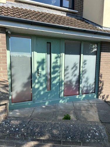 newly-installed chartwell green porch with chartwell green front door