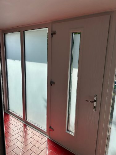 inside view of new porch with red tile floor and upvc door