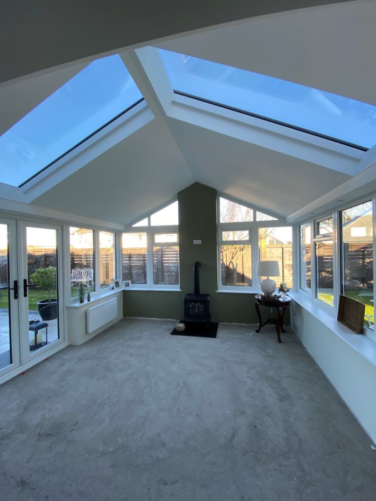 internal view of upvc conservatory with white upvc french doors