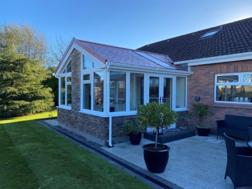 white upvc ultraroof conservatory with white upvc french doors